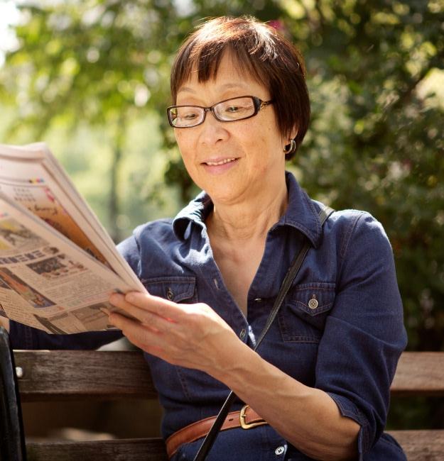 Woman reading the newspaper