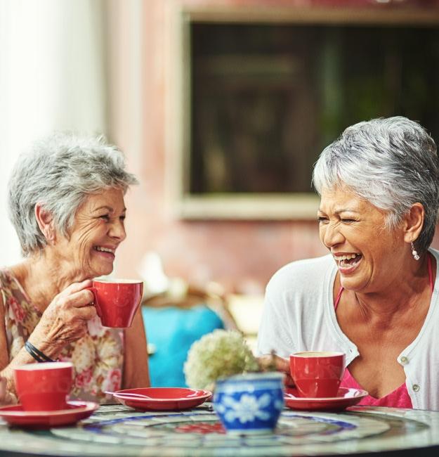 Retired women enjoying coffee together